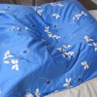 Handcrafted organic millet pillow with soft 100% organic cotton cover and premium zippered case, filled with US-grown chemical-free millet hulls for gentle, quiet, and supportive sleep comfort.