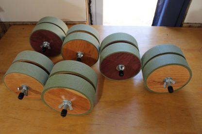A gang of wooden spine rollers.