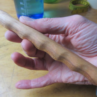 Hand carved massage stick tool.