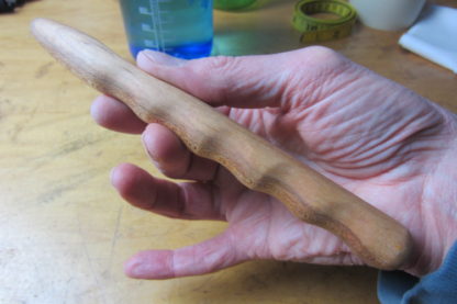 Hand carved massage stick tool.