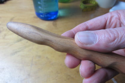 Hand carved massage stick with all natural tung oil finish.