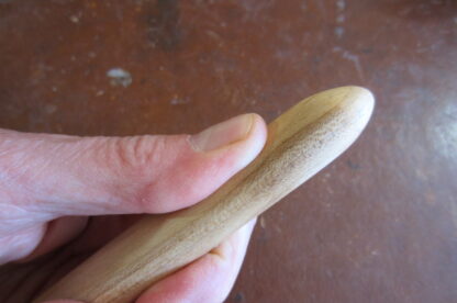 Danish massage stick pointy end.