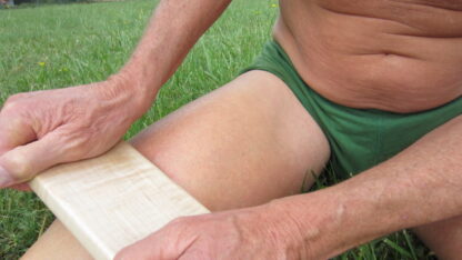 Handheld leg massage tool.